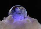USA, Indiana, Carmel. Close-up of frozen soap bubble and snow. Art Print